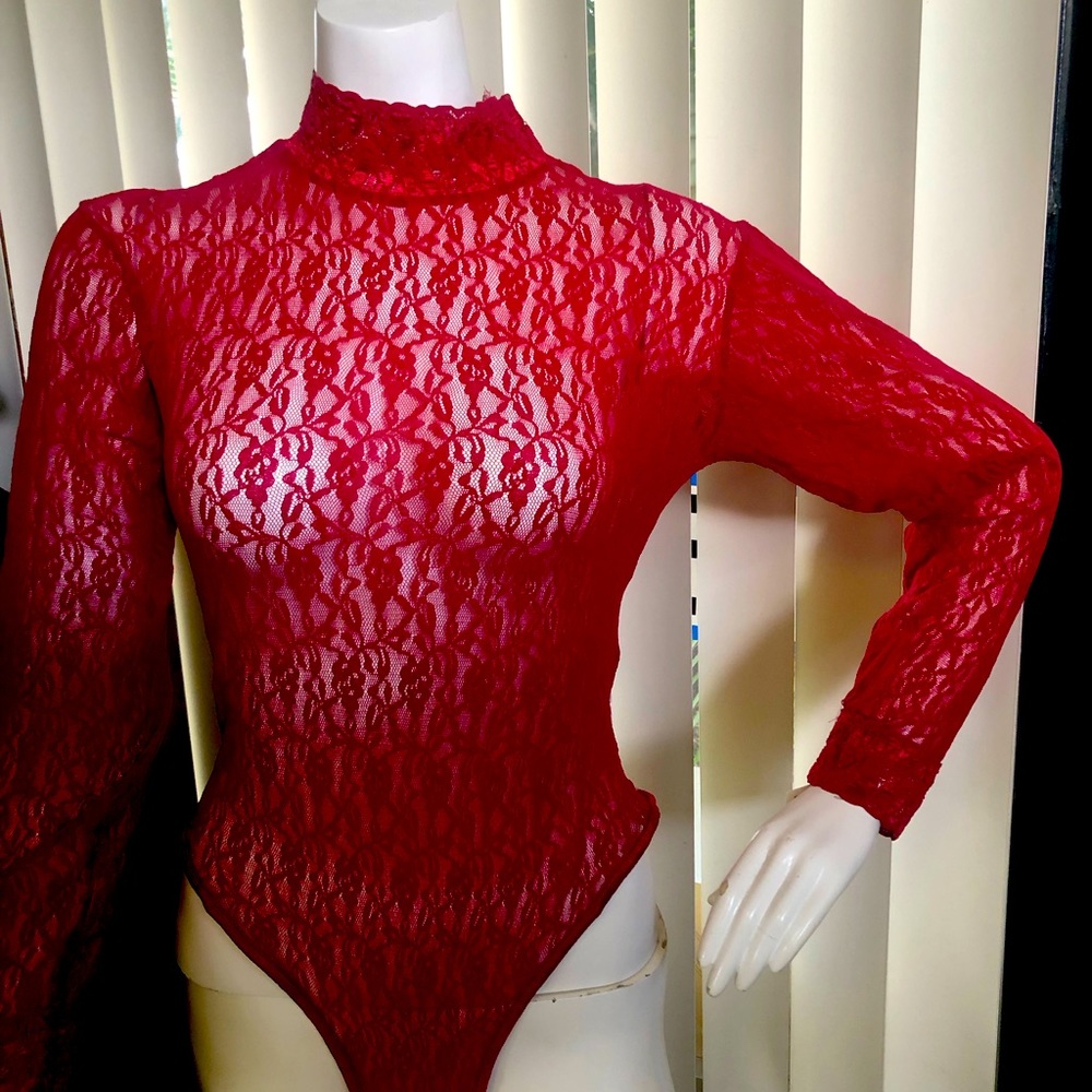 Red Lace high neck , long sleeve bodysuit. Fasten at bottom with stud buttons.